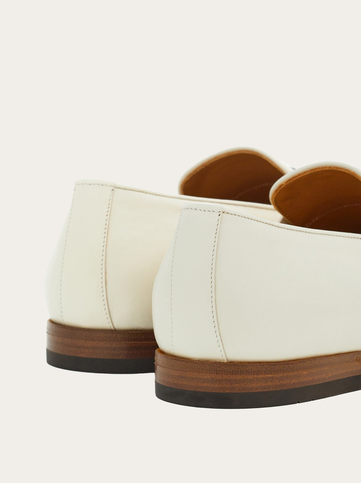 Off-white moccasin by Salvatore Ferragamo showing leather sole, bottom view