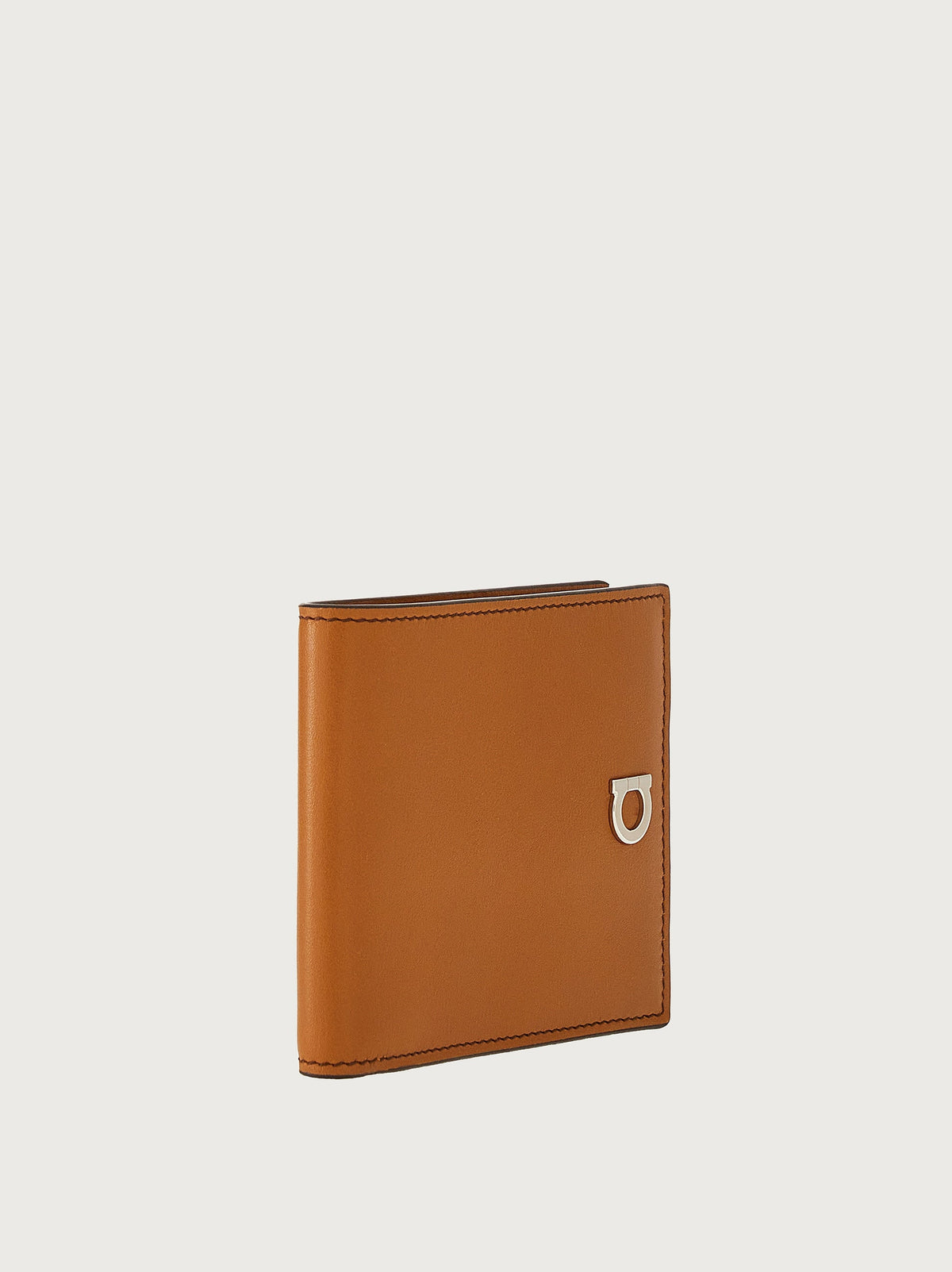 Salvatore Ferragamo tan leather wallet showing stitched edge detail, angled view