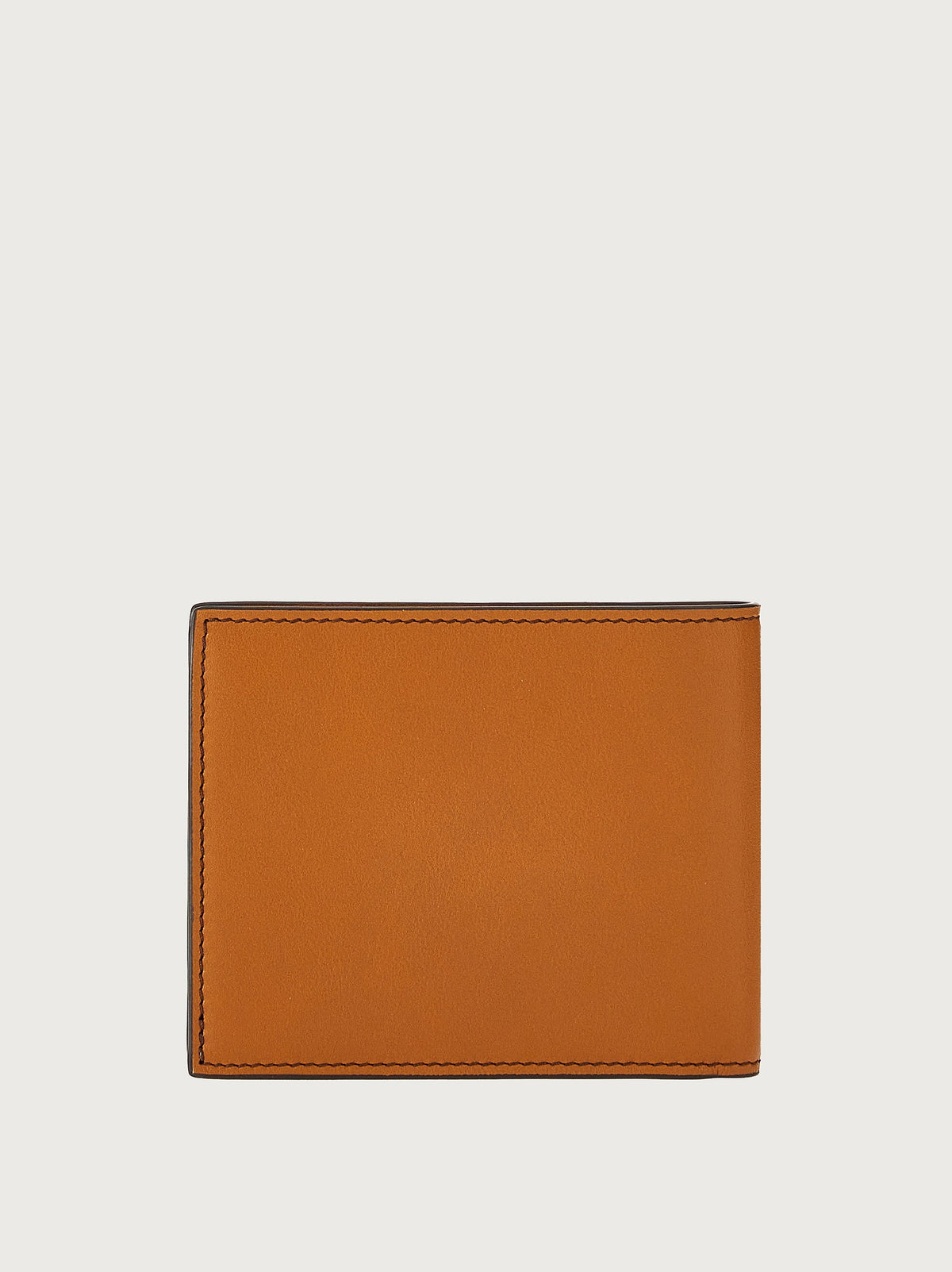 Tan bifold wallet by Salvatore Ferragamo with Gancini hardware, side view