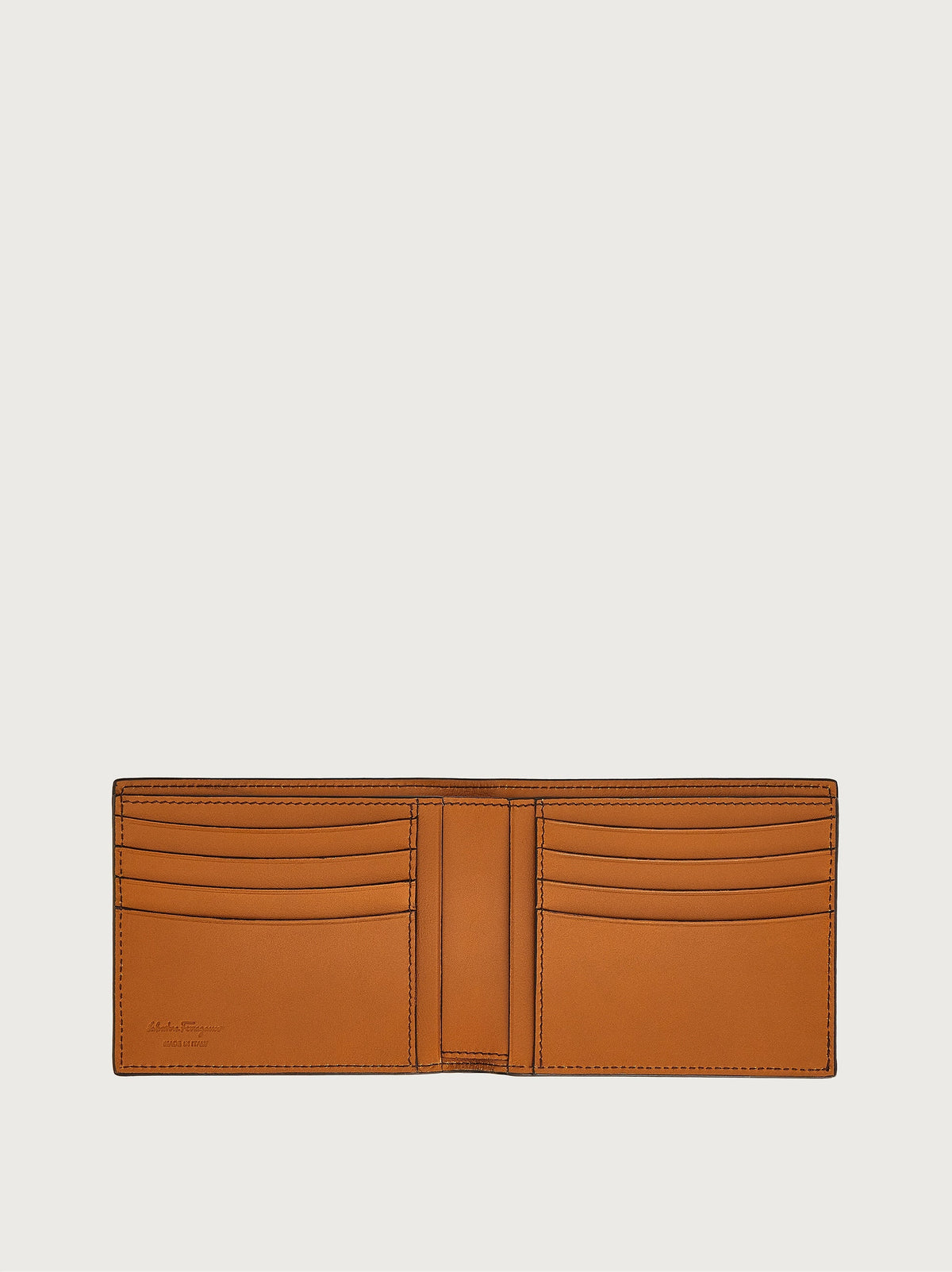 Salvatore Ferragamo leather wallet in tan showing clasp closure detail, close-up