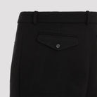 Black wool jogger pants showing belt loops and fly-zip closure by Ralph Lauren Purple Label, waist detail