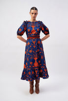 Beyond by Vera off-shoulder dress showing elastic cuffs and frills detail