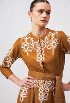 Beyond by Vera silk dress on model showing fitted waist with belt