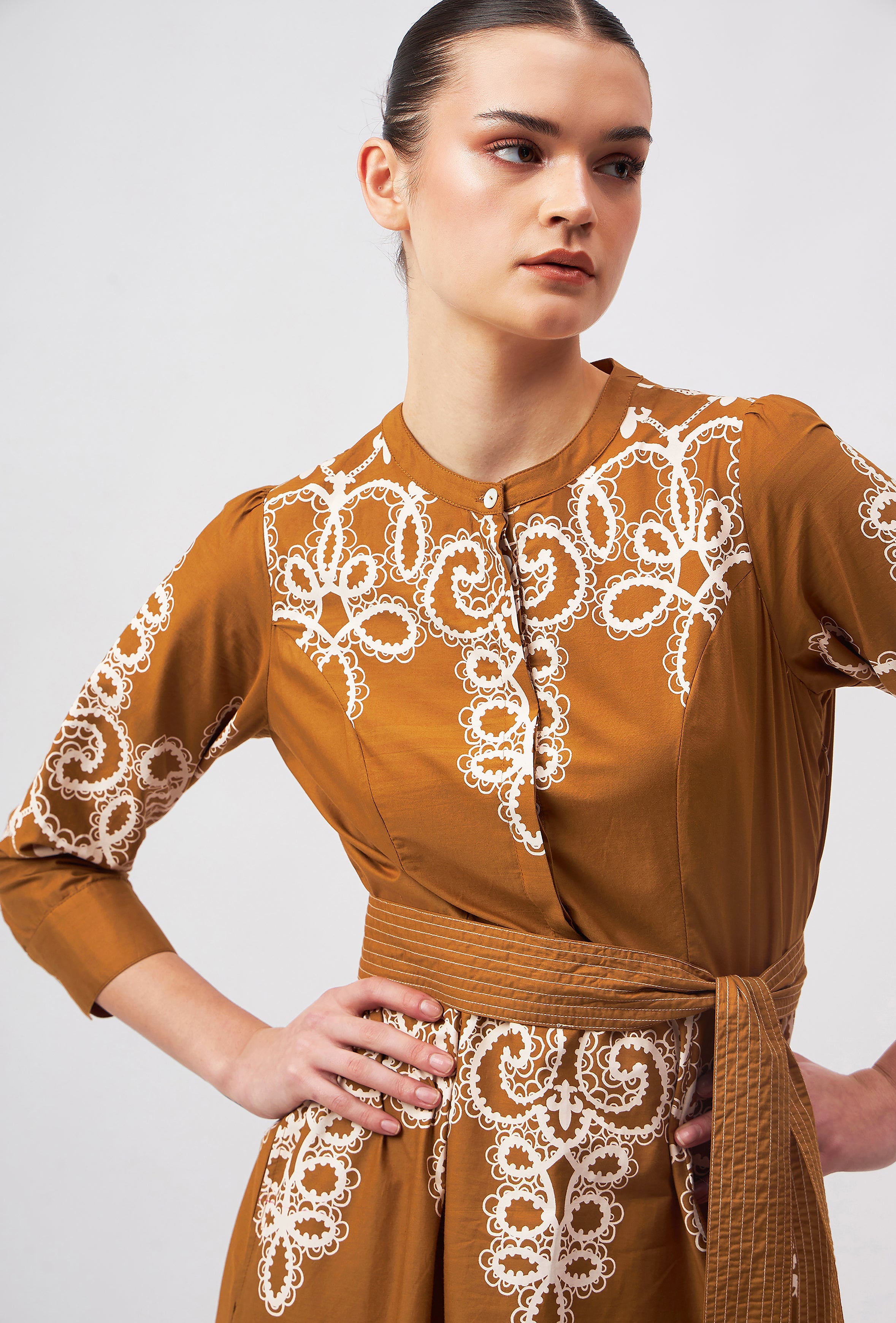 Beyond by Vera silk dress on model showing fitted waist with belt