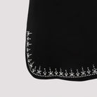 Black Rabanne mini dress with side slits, three-quarter view by Rabanne