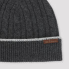 Dark grey Kiton cable-knit beanie showing logo detail and brim