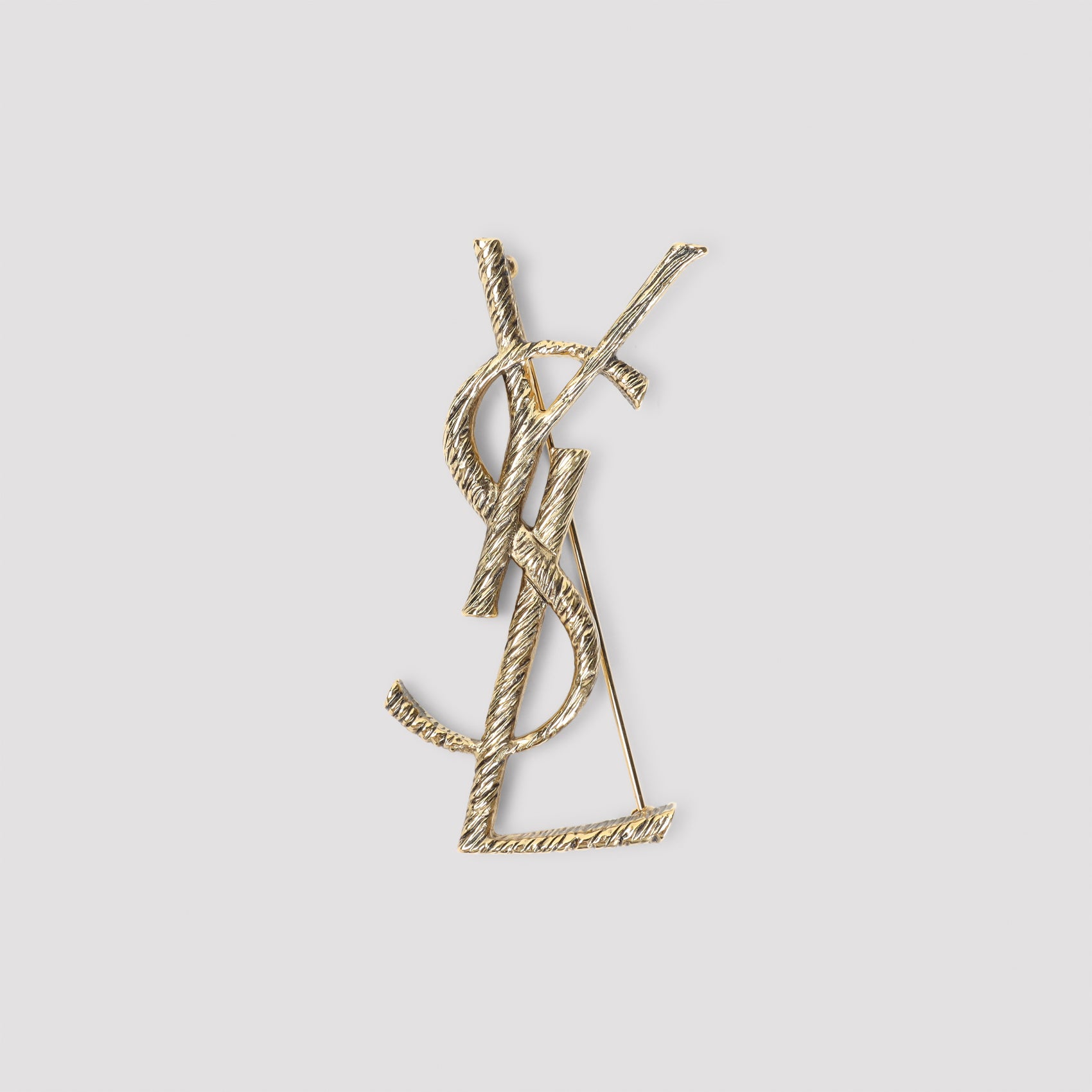 YSL Monogramme brooch detail showing brass construction by Saint Laurent