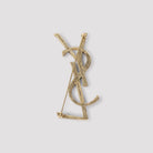 Saint Laurent golden brooch reverse side with pin fastening