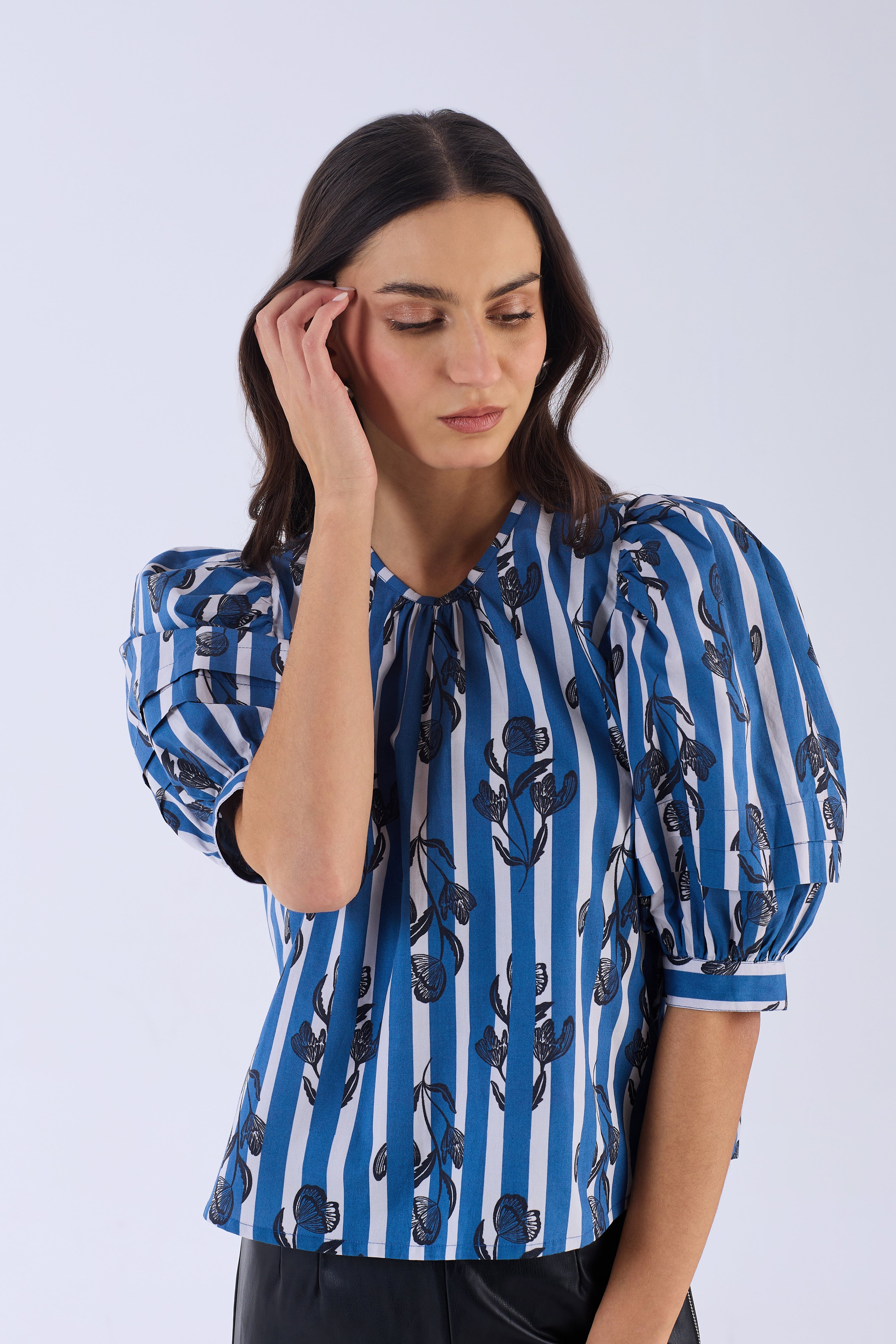 Beyond by Vera puff sleeve blouse showing floral print detail, close-up
