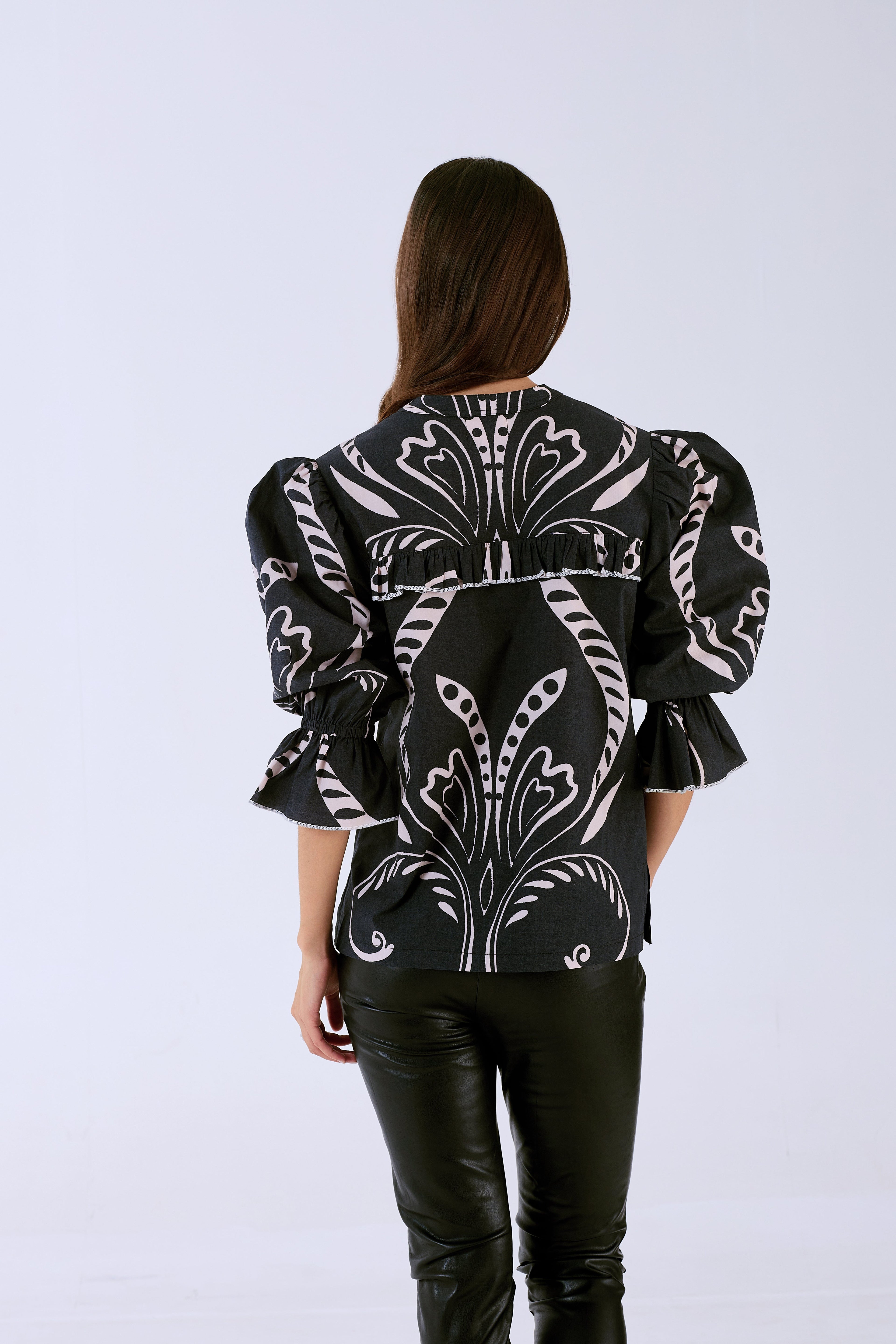 Stella blouse by Beyond by Vera with ruffle details, angled view