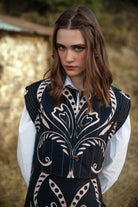 Beyond by Vera Lexie vest with button closure and cap sleeves, styled front view
