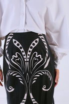 Beyond by Vera Aspen skirt in black Fountain print, three-quarter view