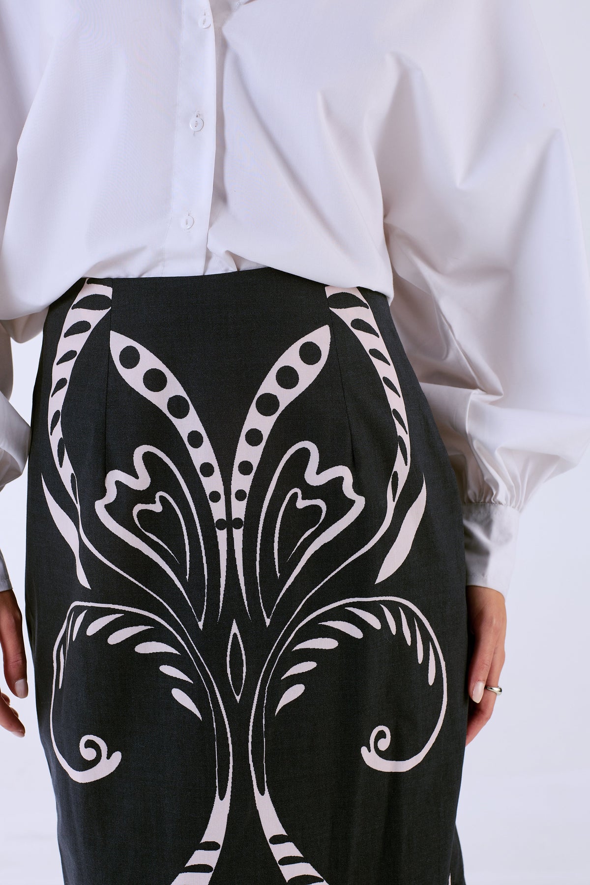Beyond by Vera Aspen skirt in black Fountain print, three-quarter view