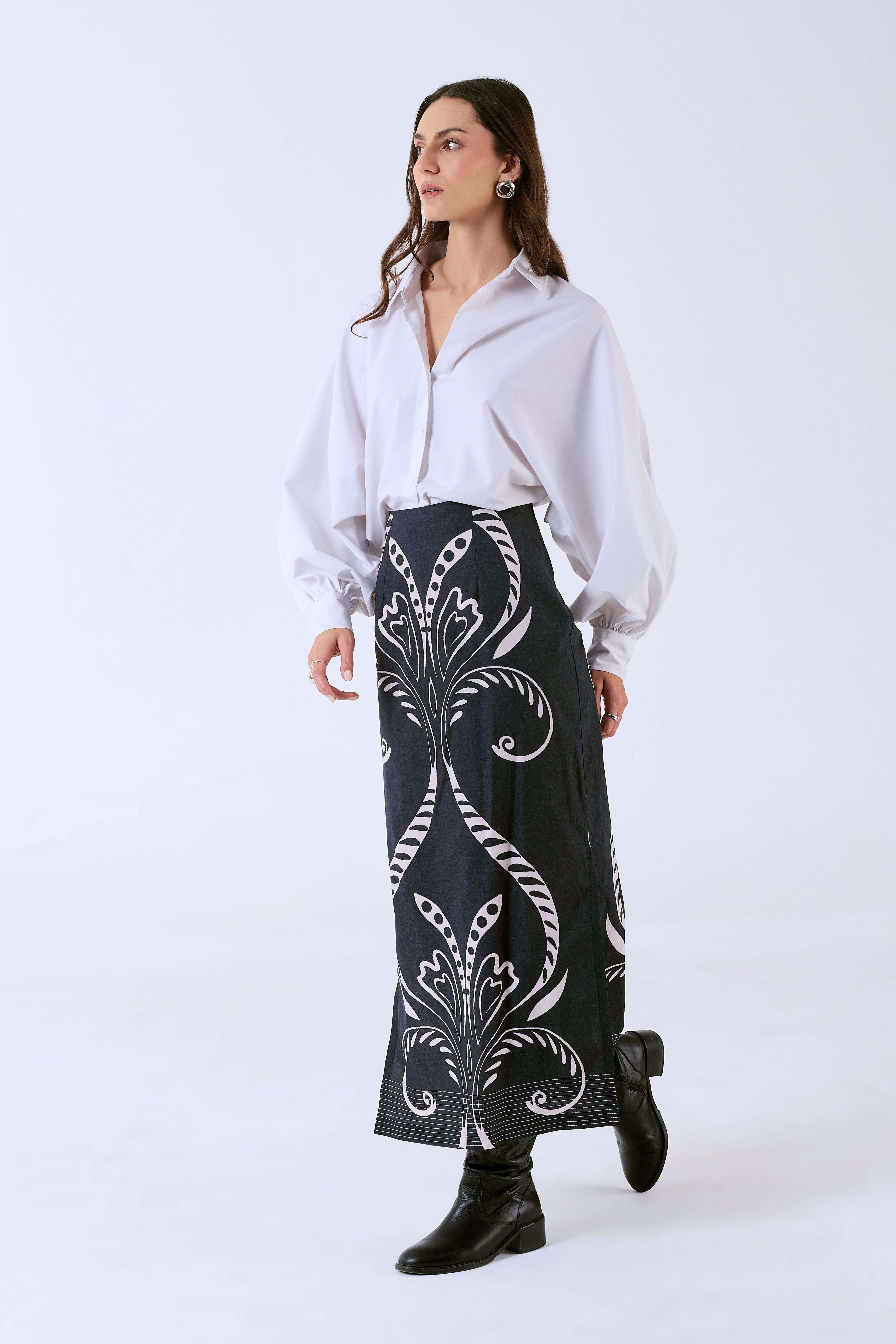 Black cotton poplin midi skirt by Beyond by Vera, side angle showing fitted silhouette