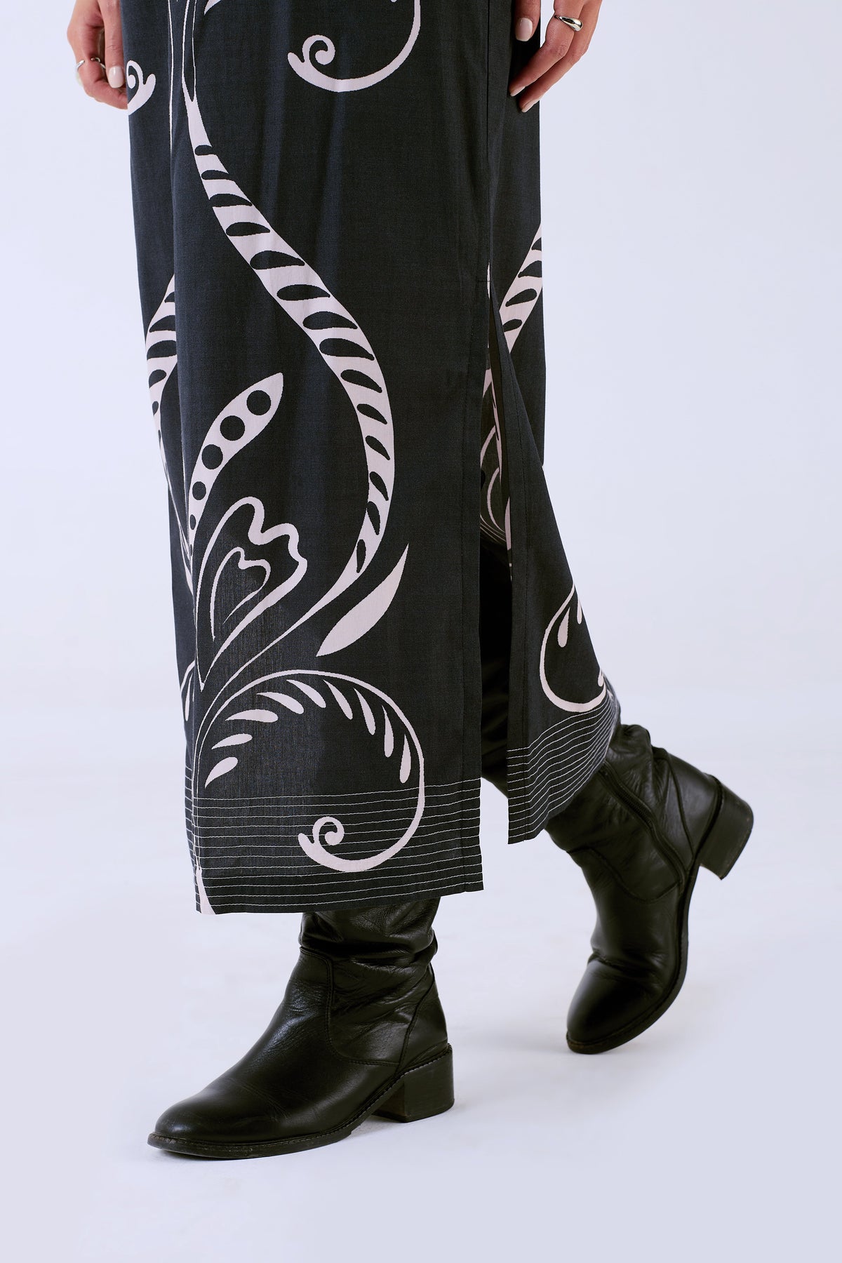 Beyond by Vera Fountain print skirt, detail view of side slit and embroidery