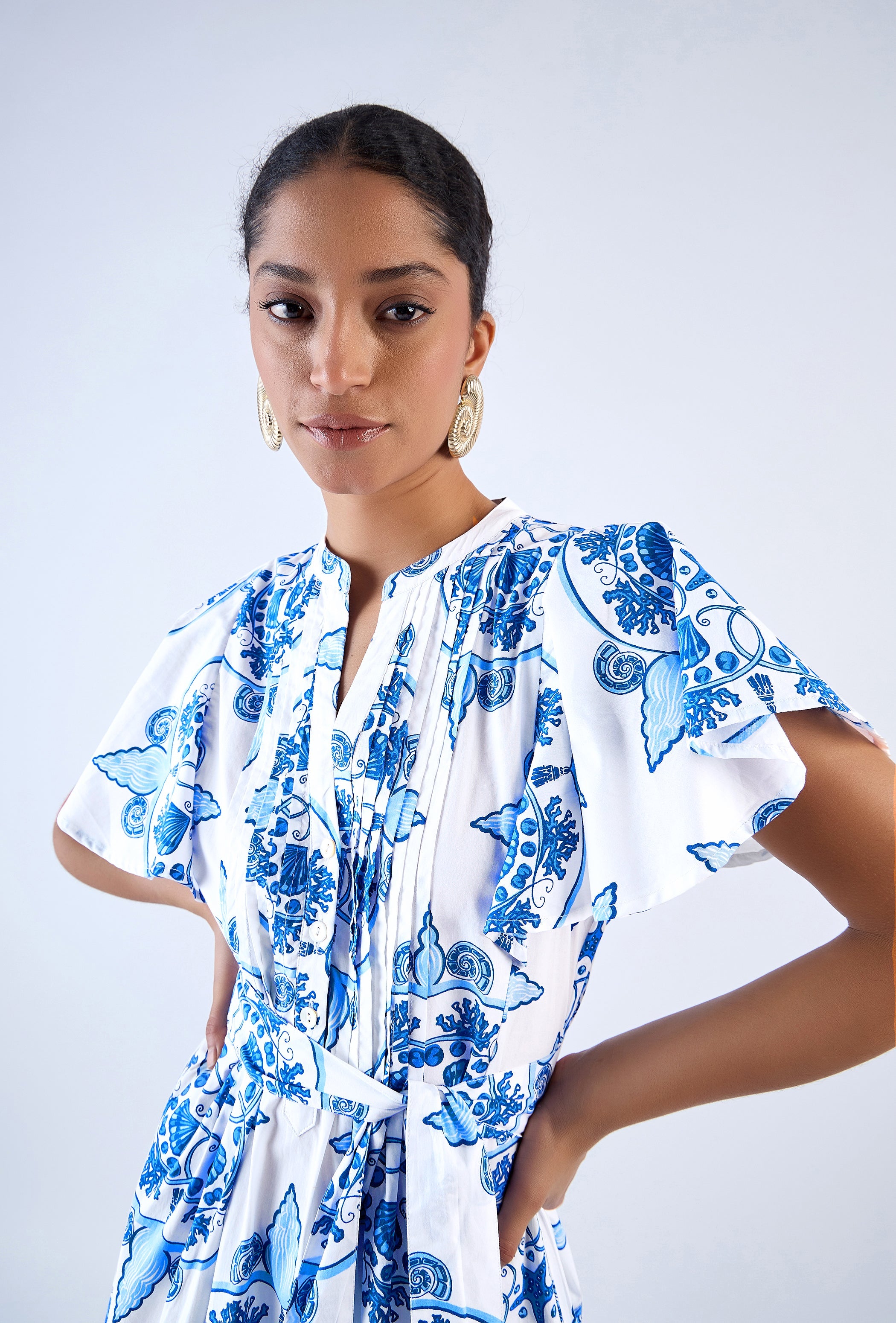 Aqua midi dress with pleated bodice and belt by Beyond by Vera, three-quarter view