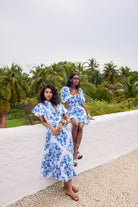 Aqua Nautilus print dress with pleated detailing by Beyond by Vera, side profile