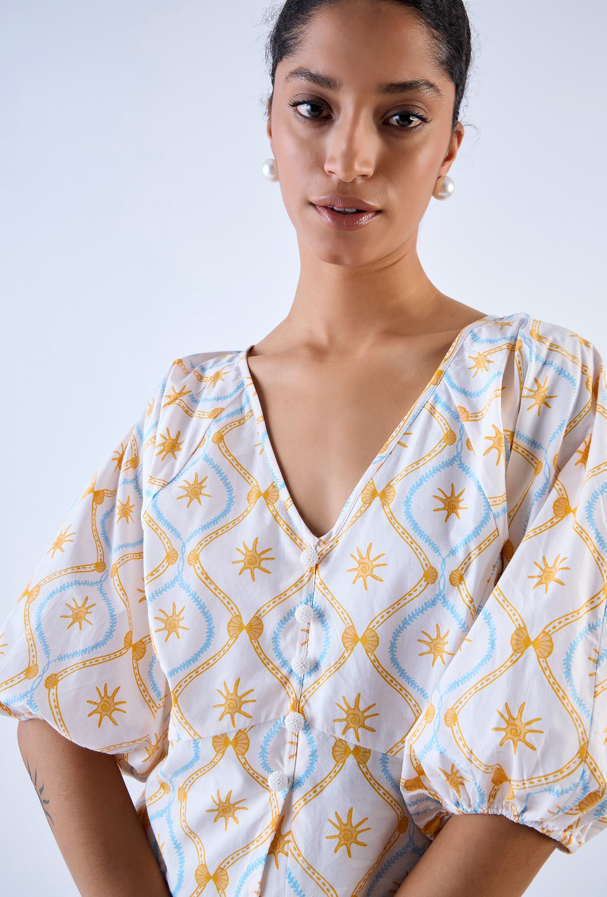 Beyond by Vera blouse with hand-sewn pearl buttons, side view
