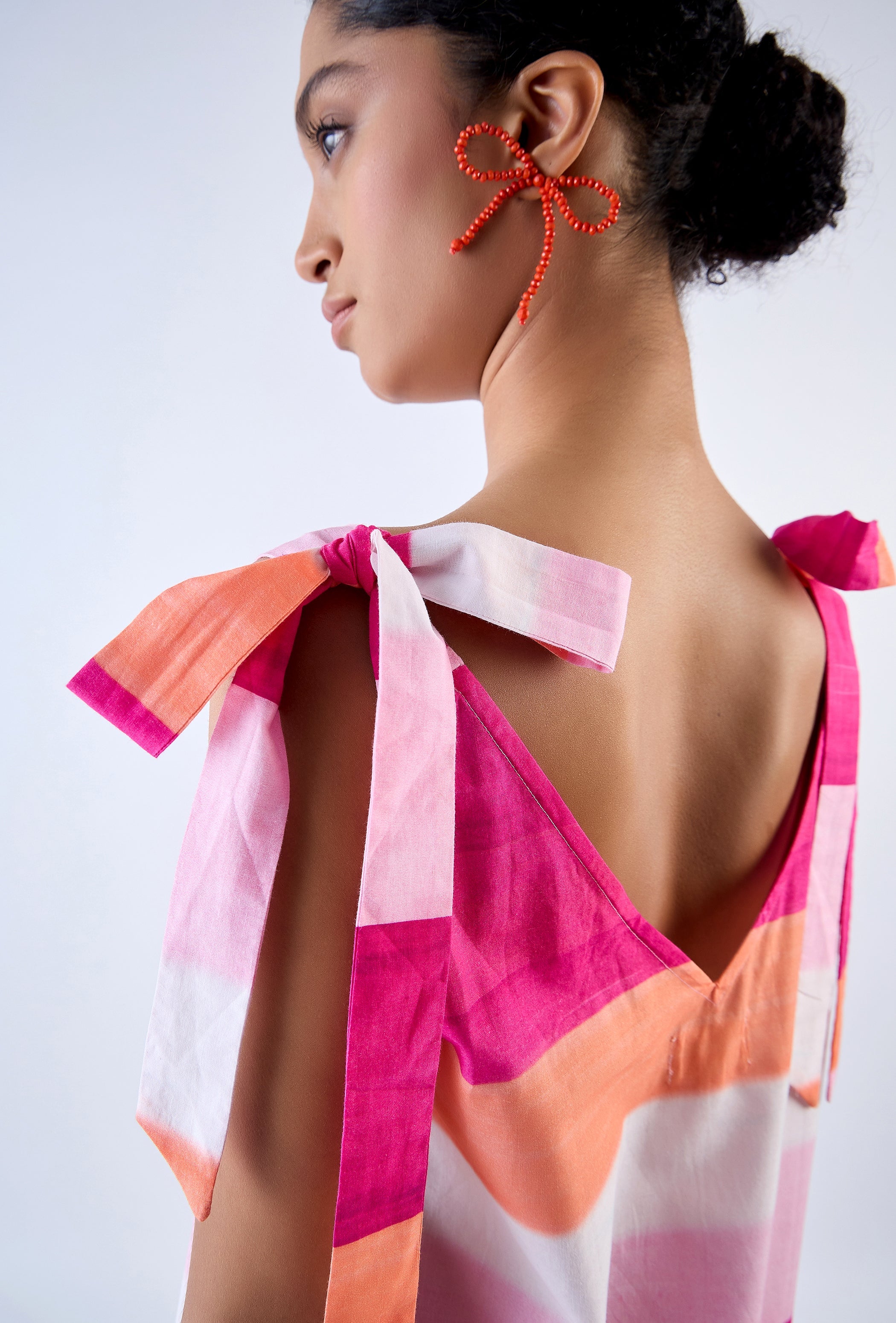 Maci mini dress with V-neckline and frill hem, side profile