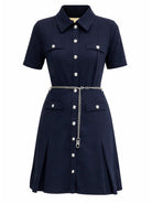 Navy scuba mini dress with chain belt by Michael Kors, styled view