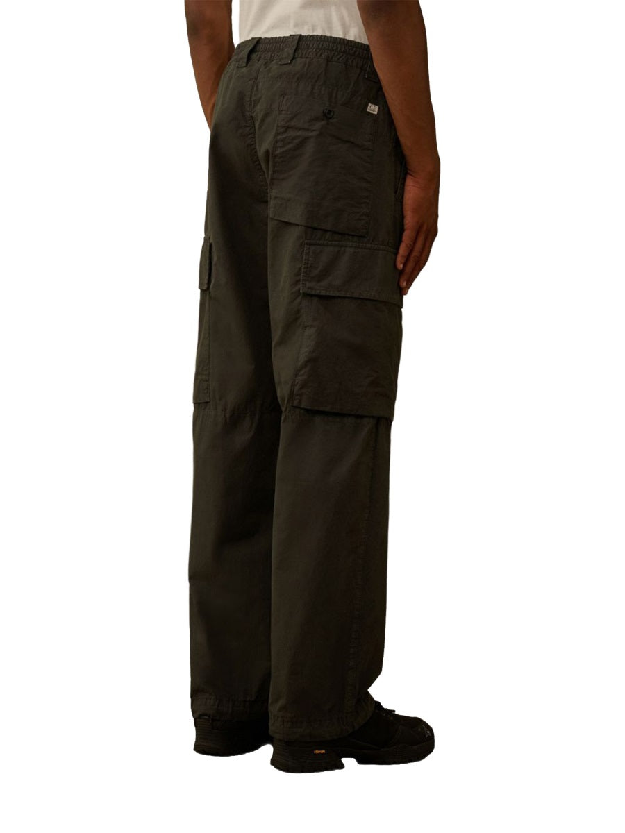 Green C.P. Company cargo trousers, detail view of construction and fabric