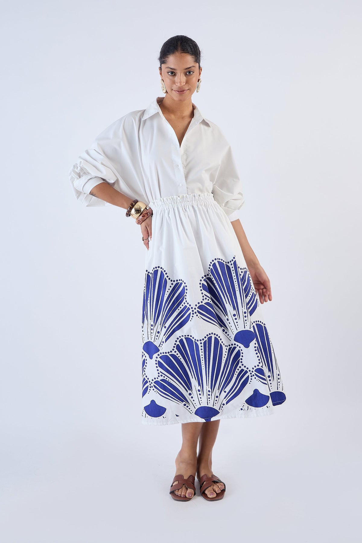 Navy A-line midi skirt with elastic waistband, side angle