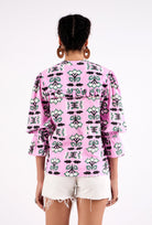 Geometric butterfly and flower print detail on cotton cambric fabric by Beyond by Vera
