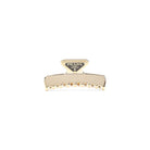 Gold Prada metal hair clip with triangle logo, side angle
