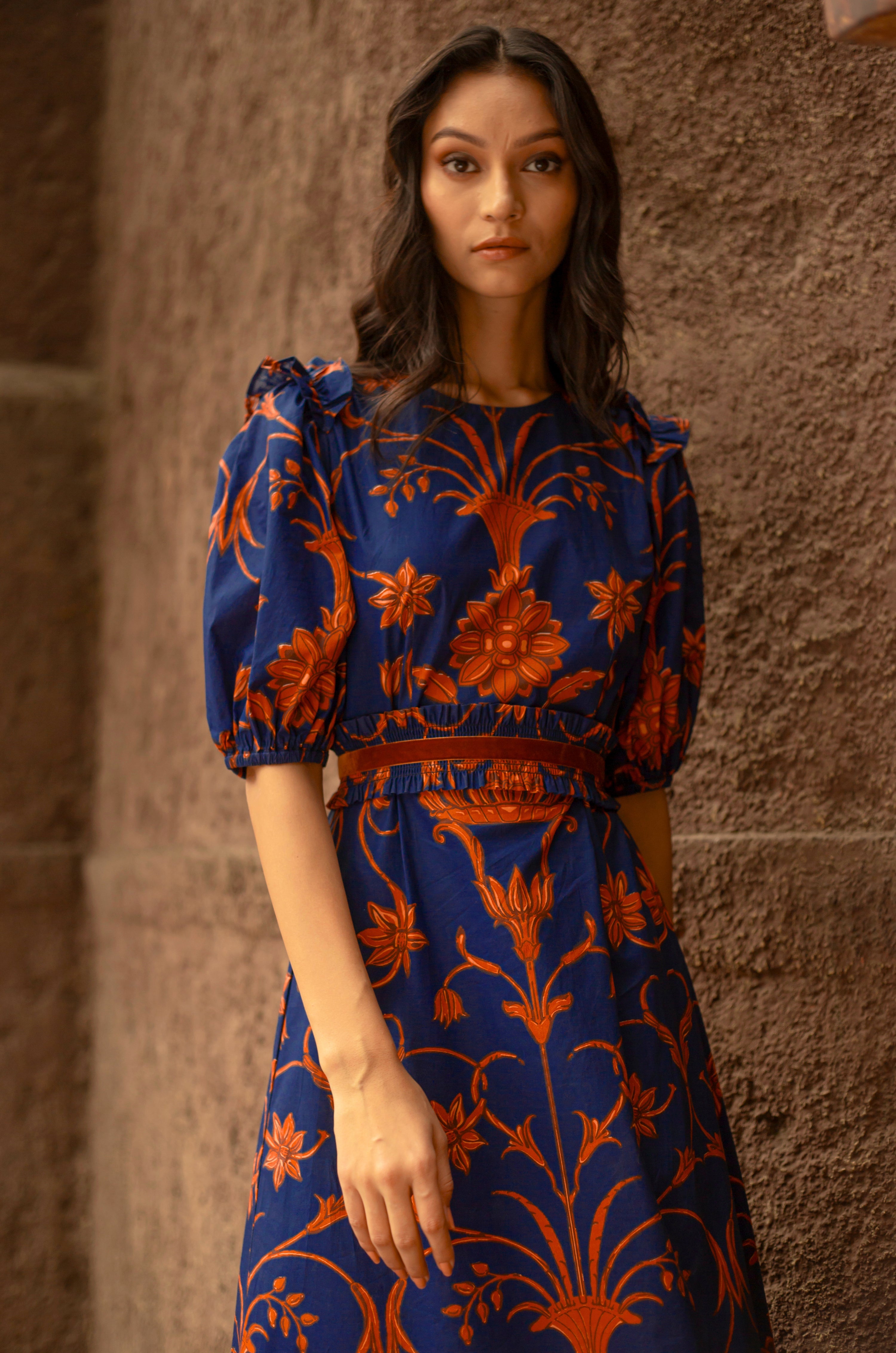 Beyond by Vera Antonia dress flat lay showing Moroccan-inspired floral print