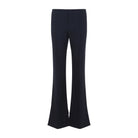 Black Chloé flare pants showing central pressed creases, side angle