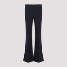 Black virgin wool flare pants by Chloé, back view with welt pockets