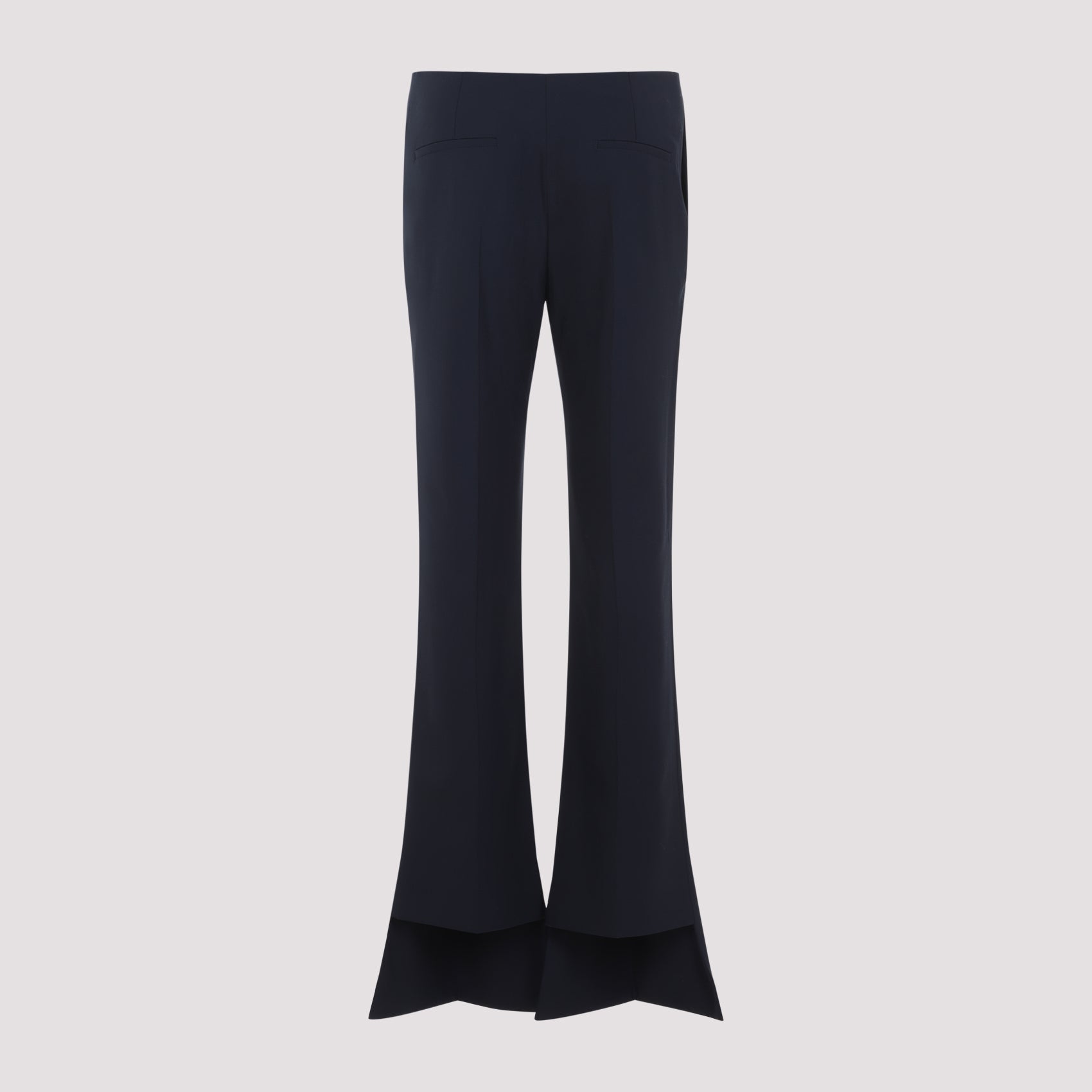 Black Chloé flare pants detail showing asymmetric hem at ankle