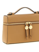 Tory Burch Romy Slim bag showing adjustable shoulder strap detail