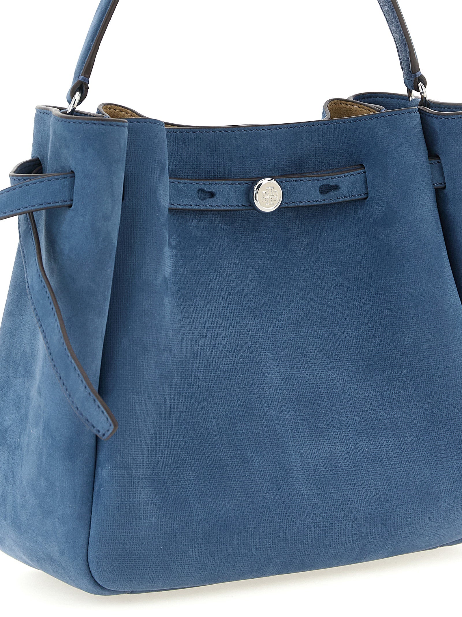 Blue nubuck Romy bucket bag showing top handle and shoulder strap, angled view