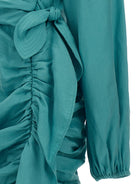 Turquoise Ungaro Dominique mini dress showing draped skirt detail, close-up view