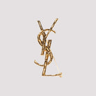 Gold-toned Saint Laurent Opyum brooch with YSL emblem, front view