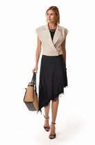 Black satin midi skirt side view showing bias-cut drape by Lord & Taylor Heritage