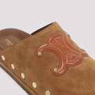 Brown suede Celine Triomphe wedge mules showing leather insole, interior view