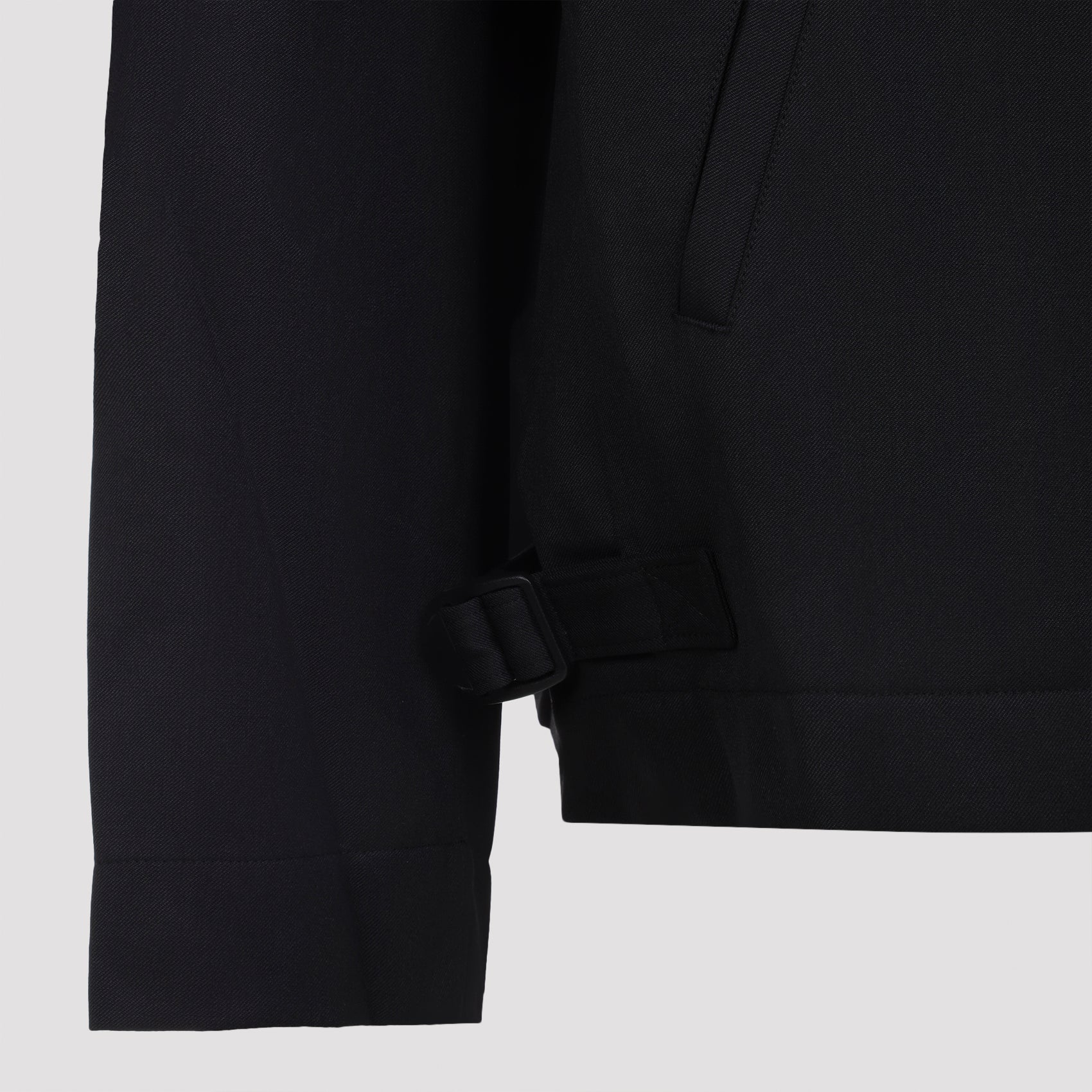 Y-3 Refined Jacket showing sliding tabs at side hems, close-up