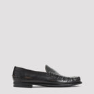 Black aged-effect leather loafer by Prada, side view