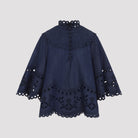 Ink blue Zimmermann broderie denim top with bell sleeves, front view