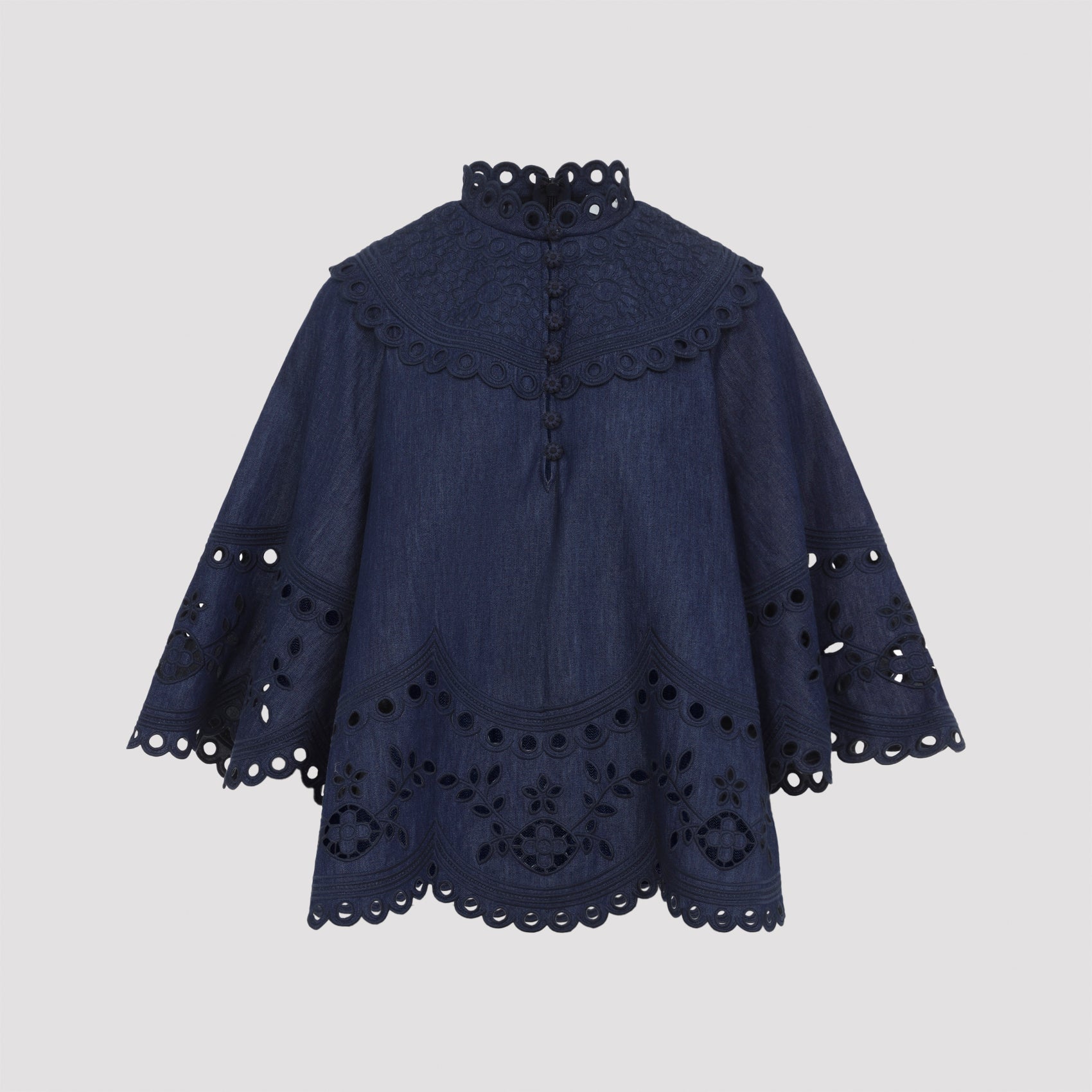 Blue broderie anglaise denim top by Zimmermann, back view