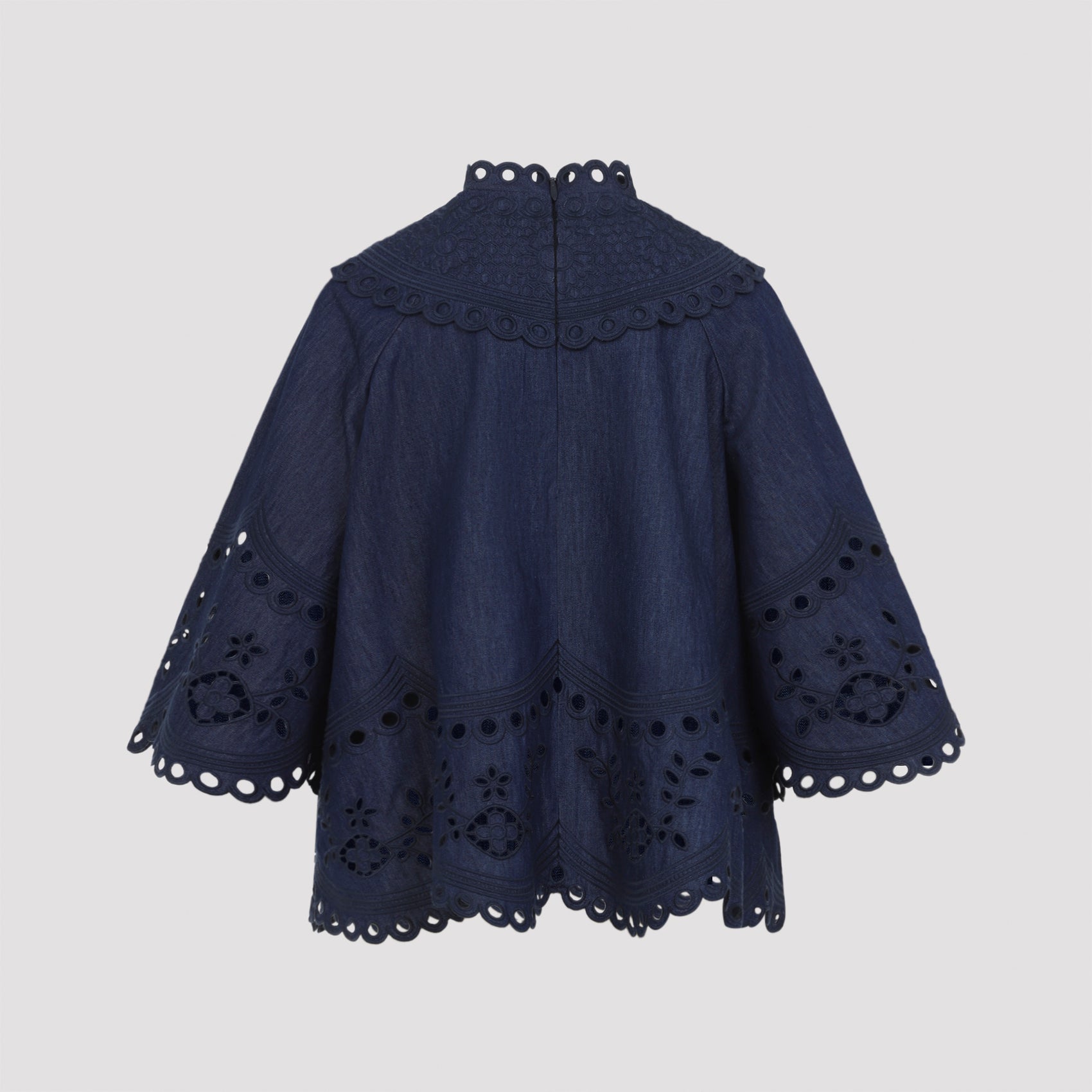Zimmermann denim blouse with scalloped trim detail, close-up