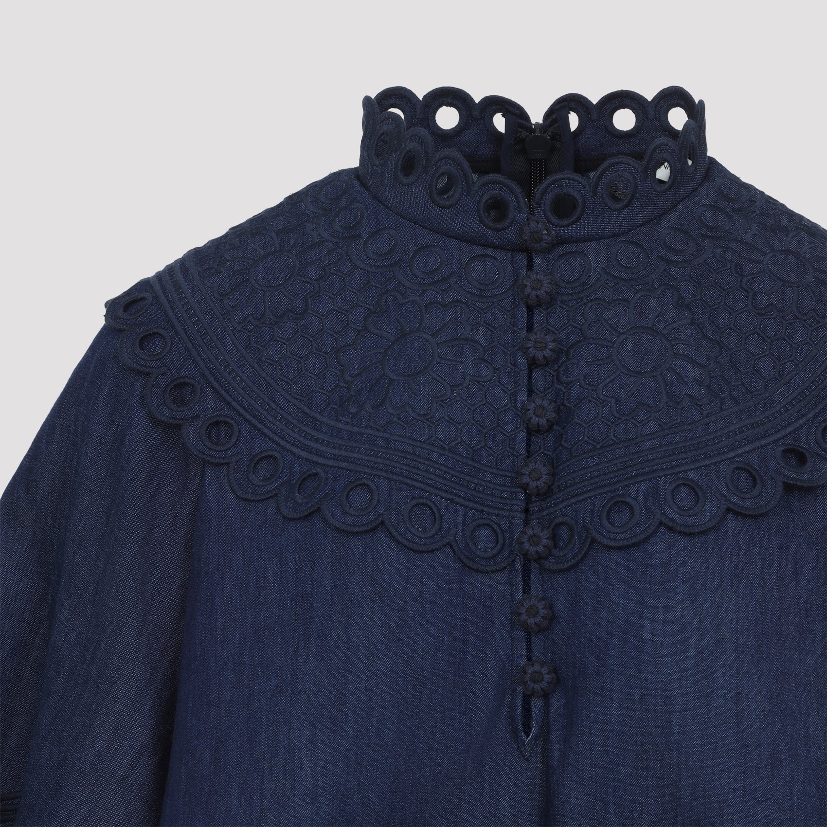 Ink blue Zimmermann top with broderie embroidery, three-quarter view