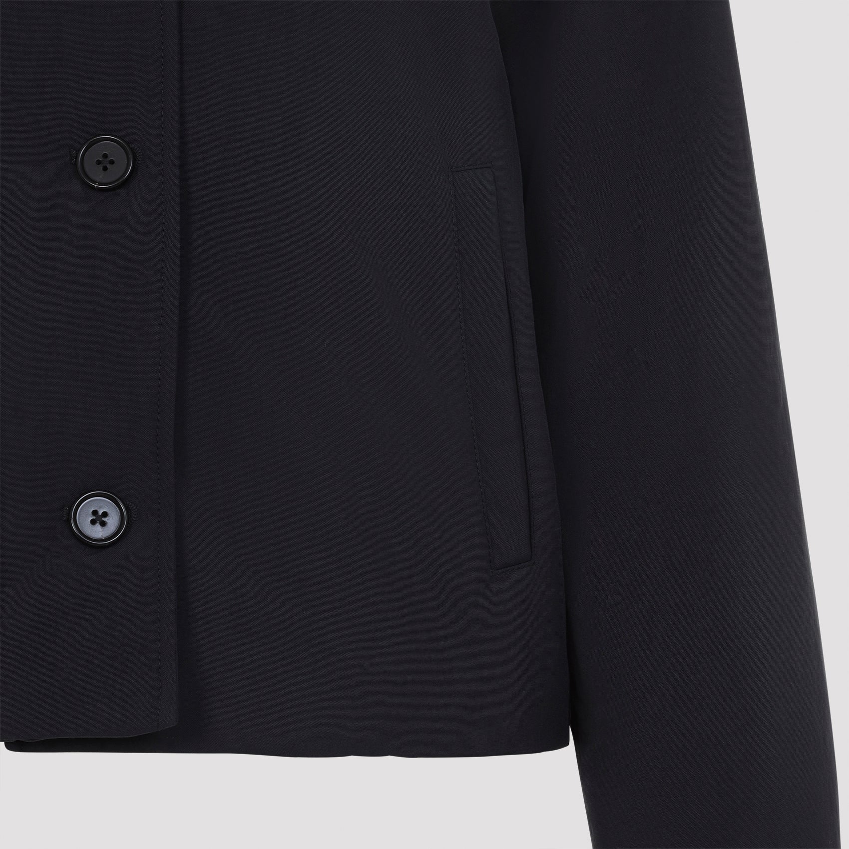 Midnight blue Jil Sander cropped blazer, close-up of technical fabric texture