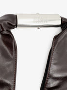 Black glossy leather shoulder bag by MM6 Maison Margiela, interior lining detail