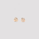 White Bottega Veneta knotted stud earrings showing sculptural twisted design detail