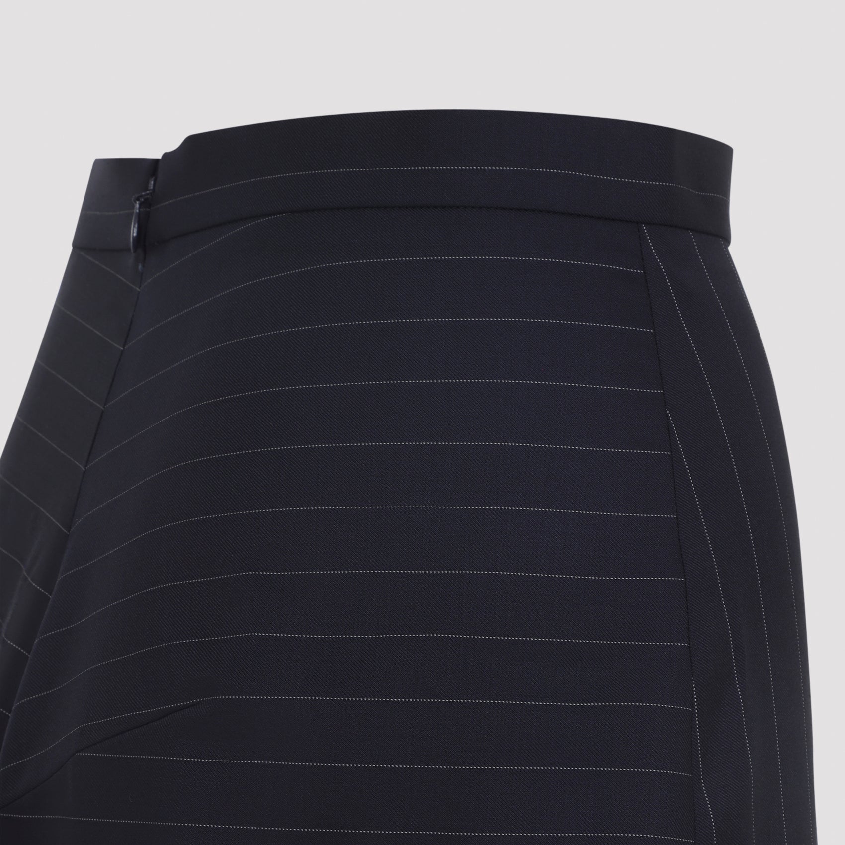 Dark navy Givenchy pinstriped wool midi skirt, close-up of wool fabric texture