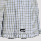 Miu Miu mini skirt in white checked cotton, close-up of logo patch