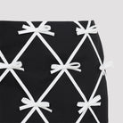Black Moschino virgin wool mini skirt with ribbon lattice motif, detail view